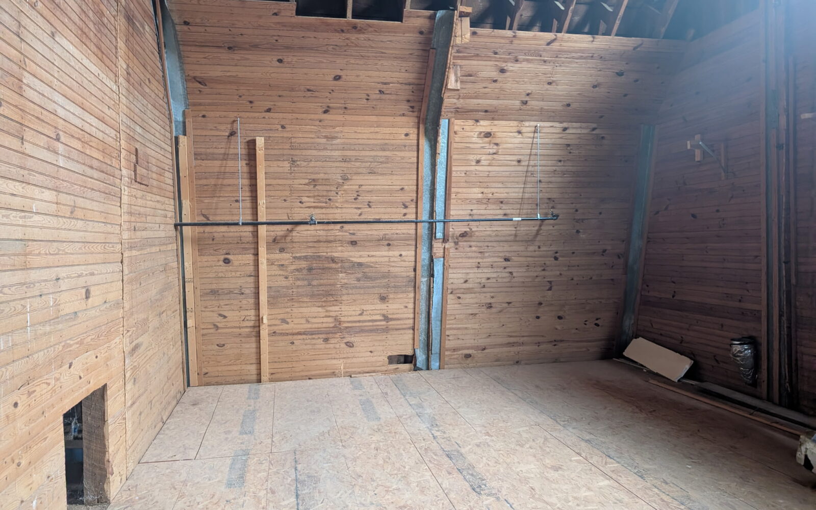interior of wood paneled barn